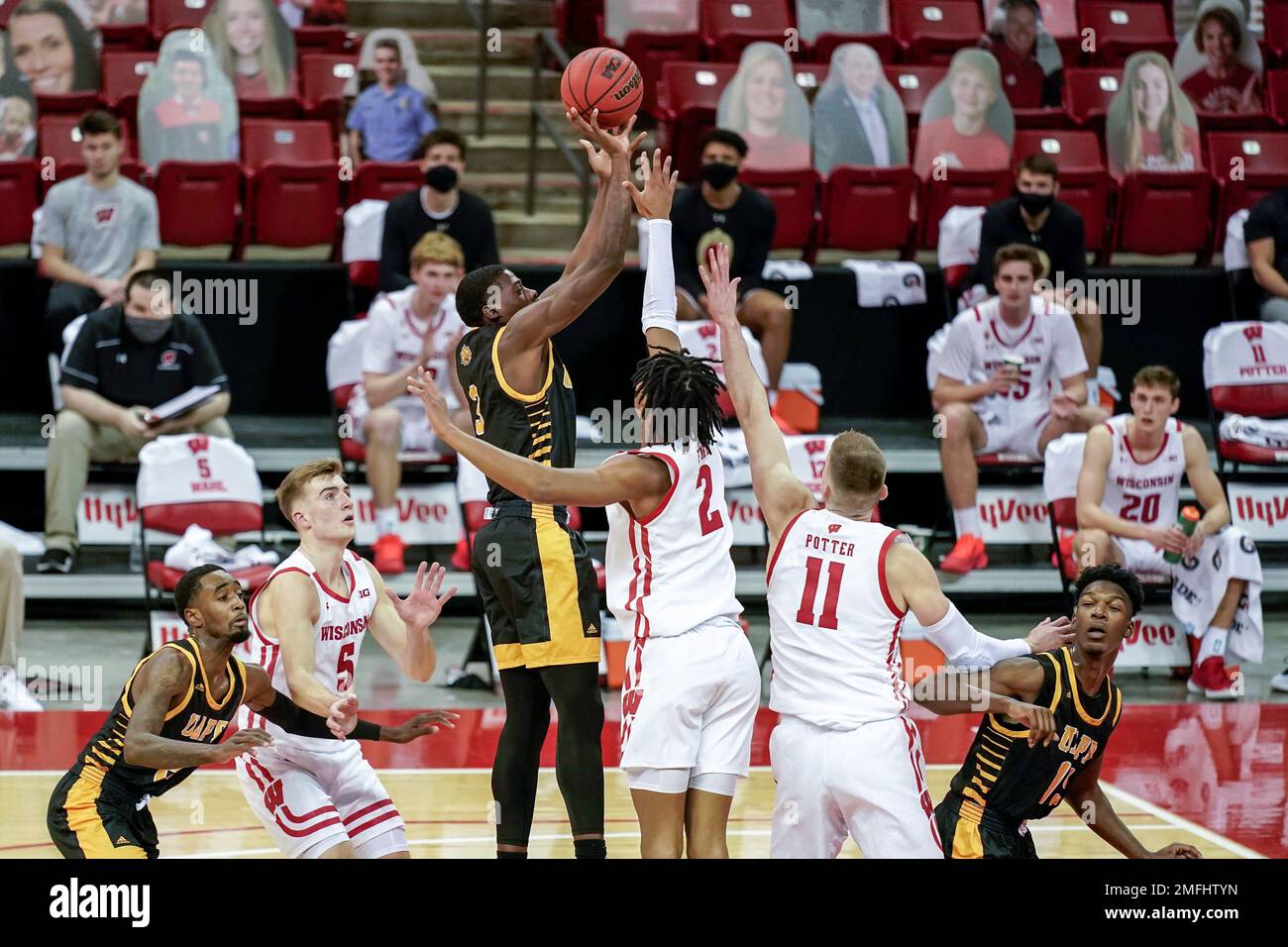 ArkansasPine Bluff's Markedric Bell (3) and Wisconsin's Aleem Ford (2
