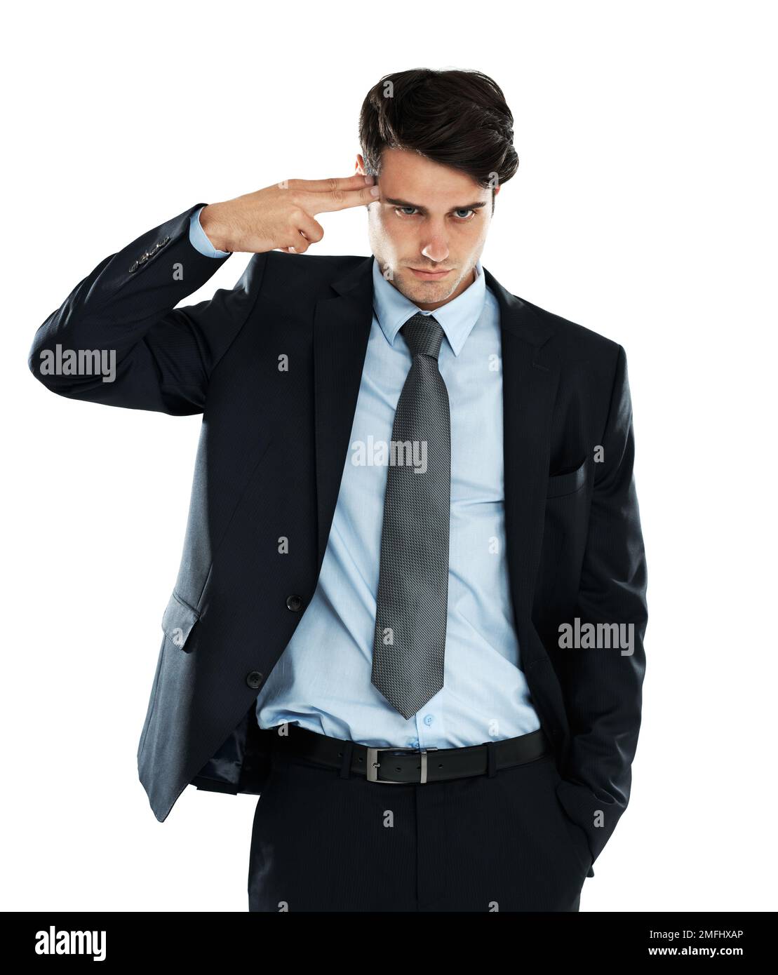 Businessman, depression and hand gun to the head in studio for stress against a white background. Anxiety, suicide and young entrepreneur suffering Stock Photo