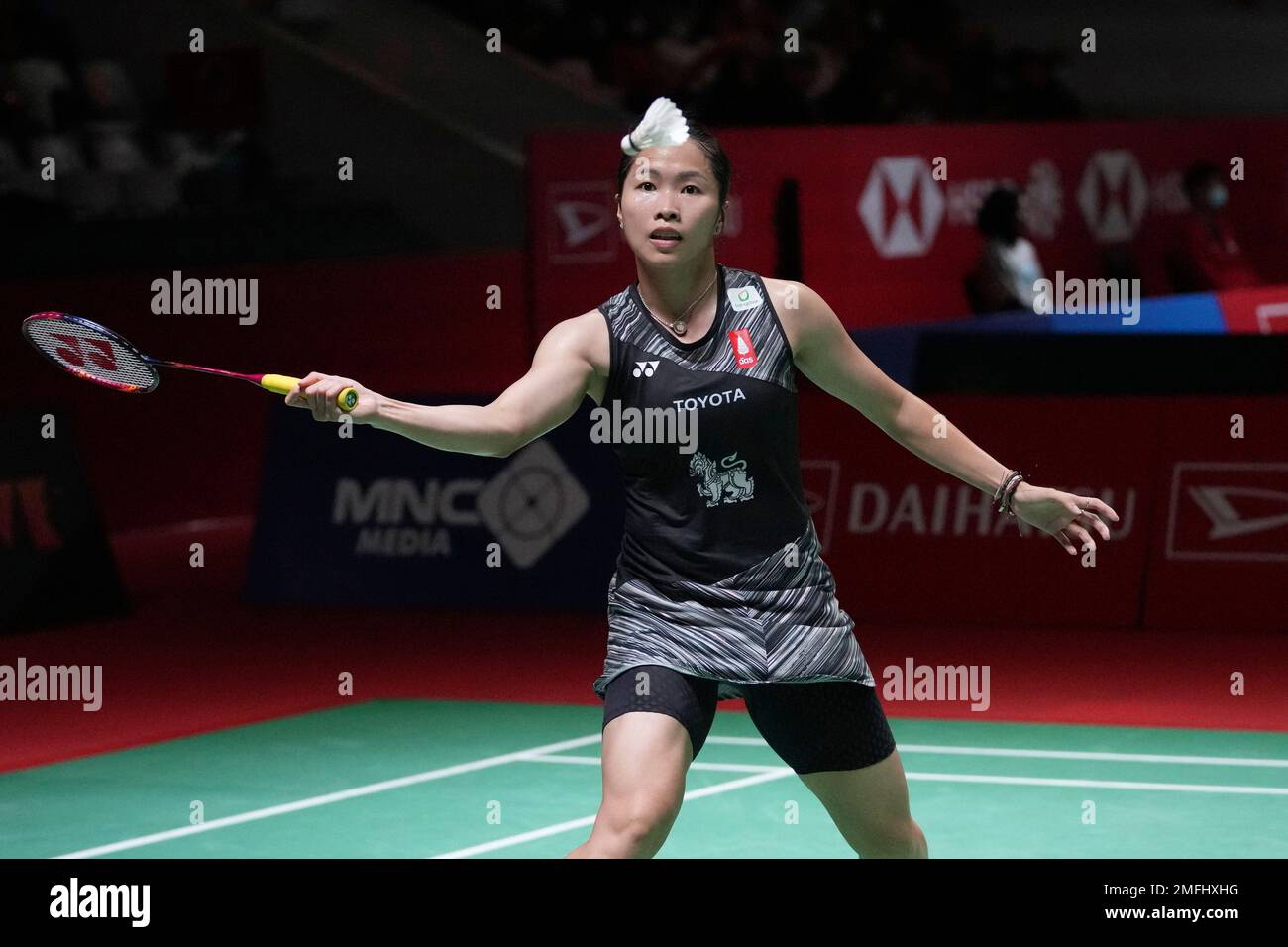 Ratchanok Intanon of Thailand returns a shot to Malvika Bansod of India during the womens single match in the Indonesia Masters badminton tournament in Jakarta, Indonesia, Wednesday, Jan