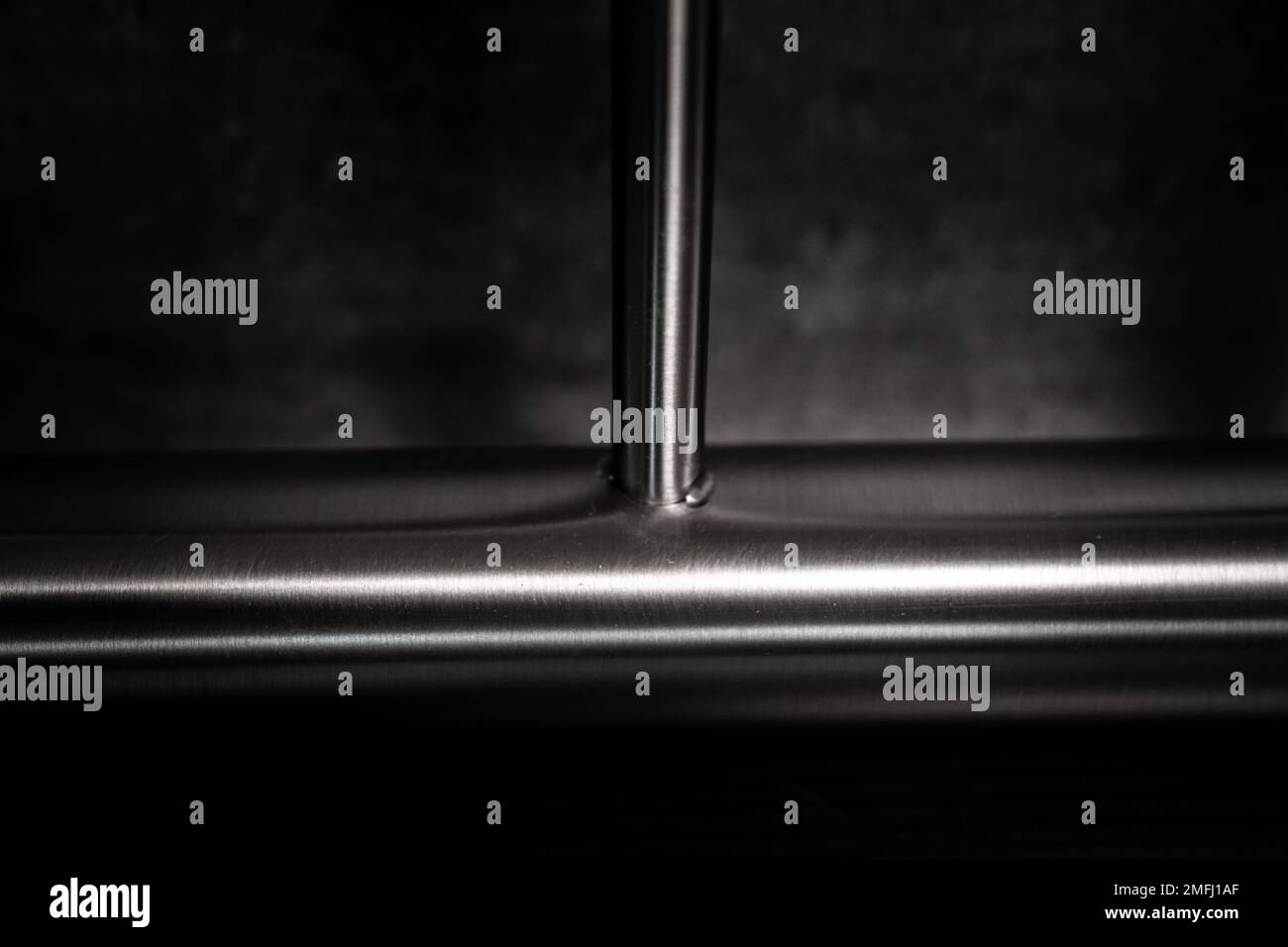 stainless steel railings on a dark background Stock Photo - Alamy