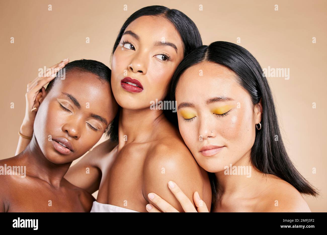Women support, makeup and face dermatology for skincare wellness, cosmetics beauty and closed eyes in brown background studio. Young model, diversity Stock Photo