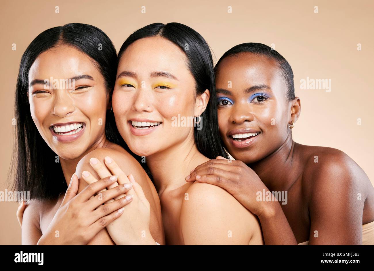 Makeup, diversity and woman happiness together for support, facial wellness and cosmetics dermatology care in brown background studio. Model, smile Stock Photo