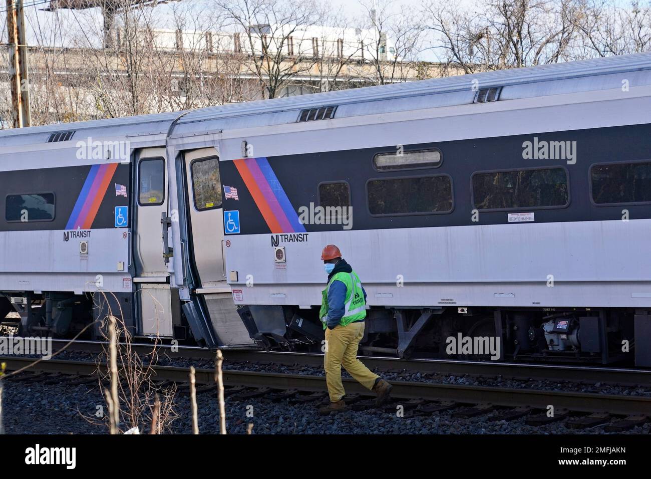 a-new-jersey-transit-employee-walks-near-a-derailed-train-in-perth