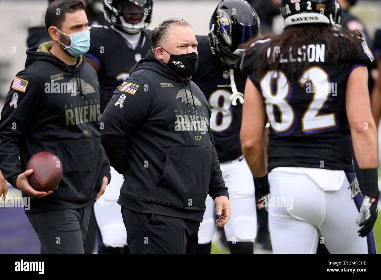 Baltimore Ravens offensive coordinator Greg Roman, center, talks with tight  end Josh Oliver during NFL football training camp practice on Owings Mills,  Md., Wednesday, Aug. 4, 2021. (Kenneth K. Lam/The Baltimore Sun