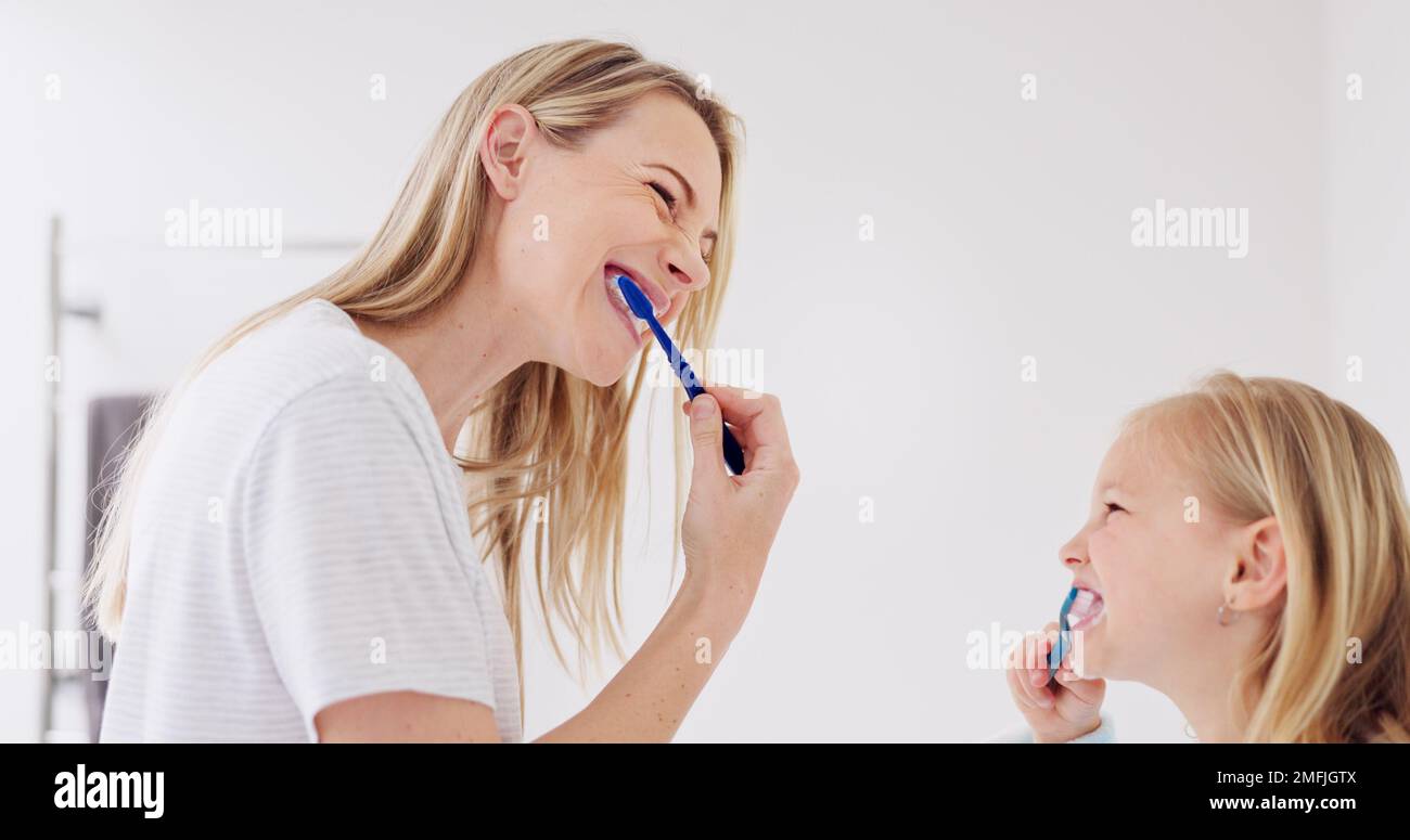 Toothbrush, mother and girl cleaning their teeth in the morning in the