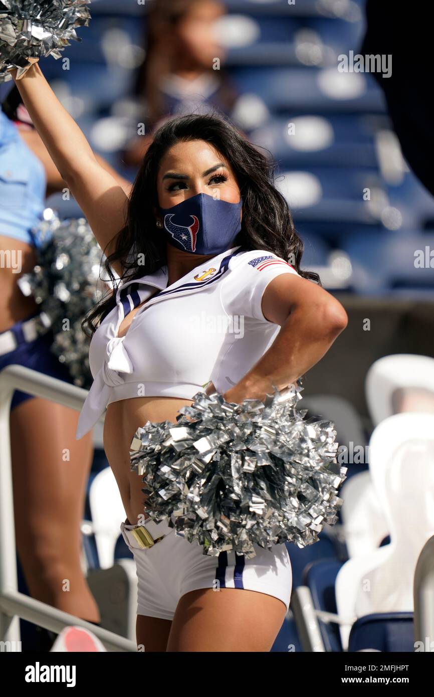 A Houston Texans cheerleader wearing a salute to service uniform