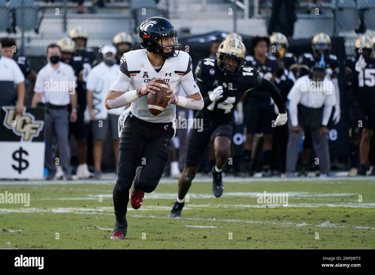 Cincinnati quarterback Desmond Ridder looks for a receiver as Central ...
