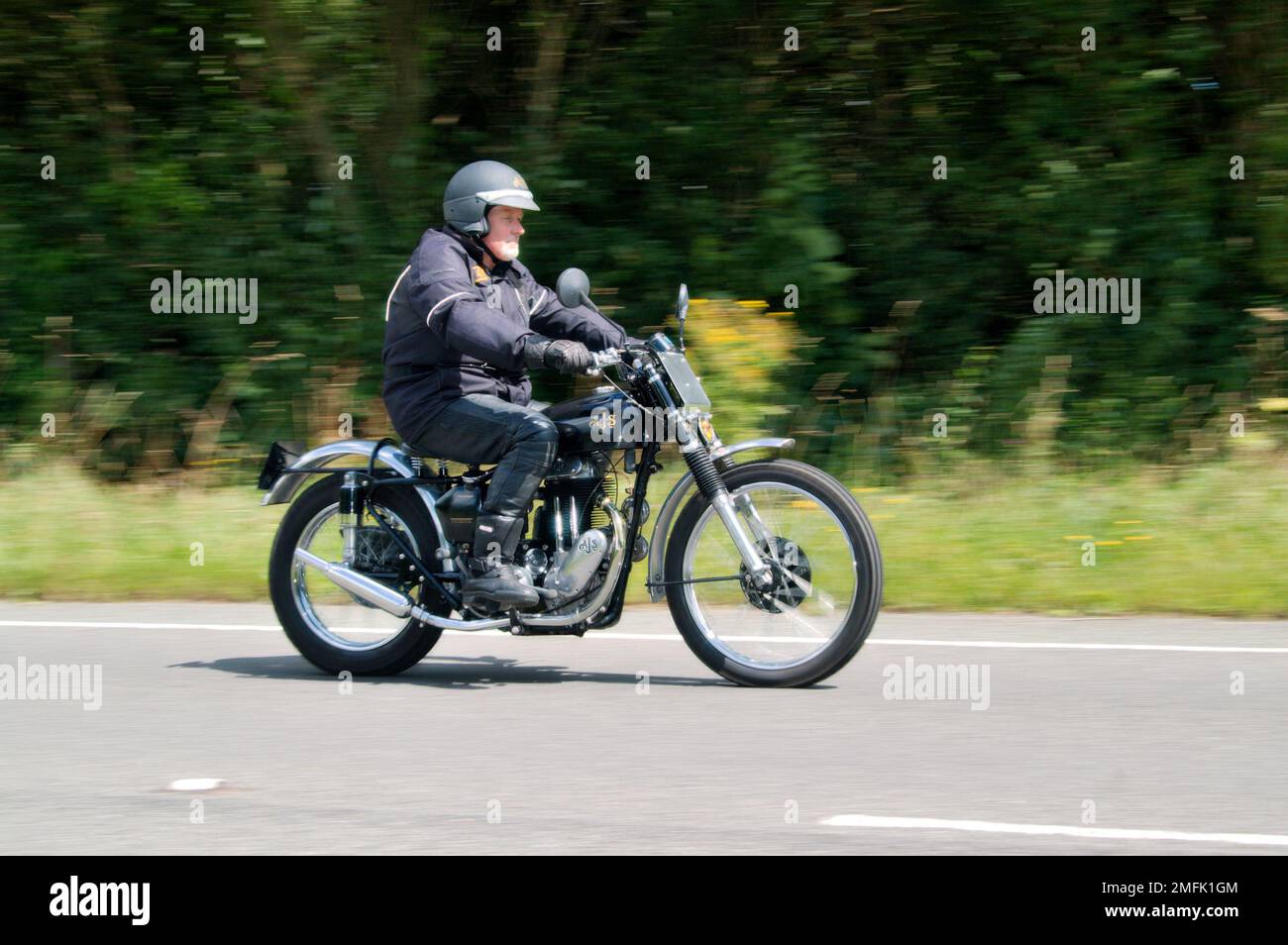 1953 AJS Model 18 500cc, owner Dave Cox riding. Stock Photo