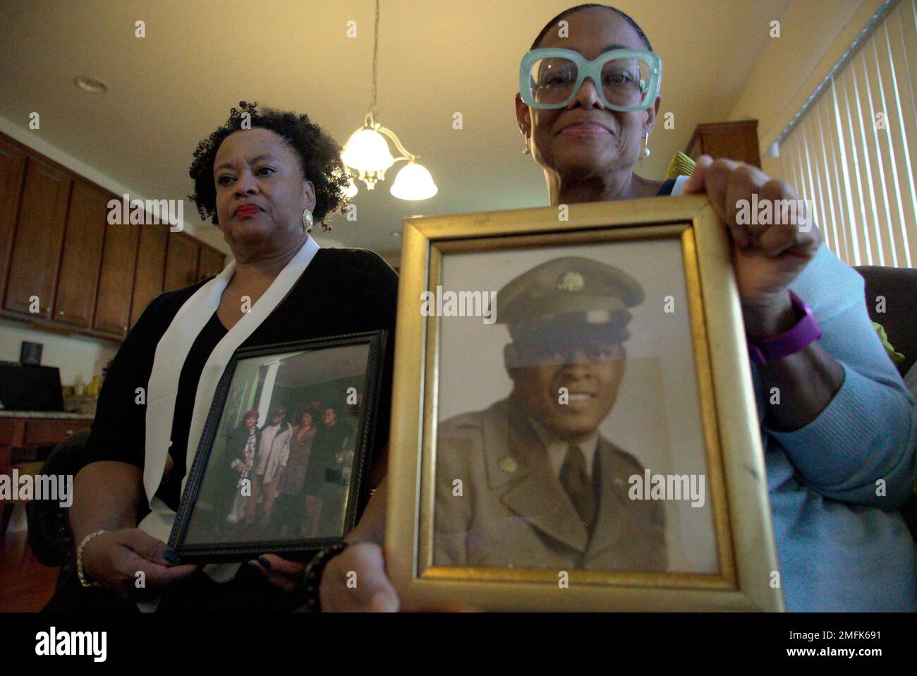 Sisters Barbara Leak-Watkins, right, and Alberta Lynn Fantroy pose with