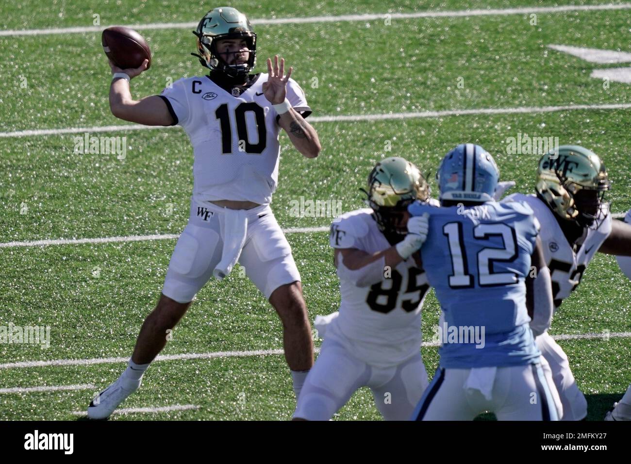 Wake Forest quarterback Sam Hartman (10) passes against North Carolina