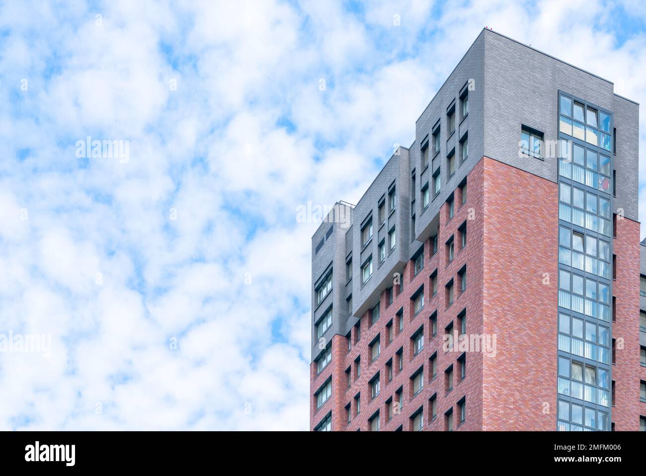 Facade of a modern skyscraper. Donstruction industry. Sale and rental of real estate. Stock Photo