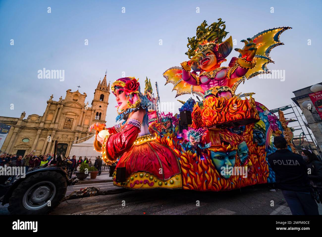 Huge floats with colourful, moving figures are pulled through the