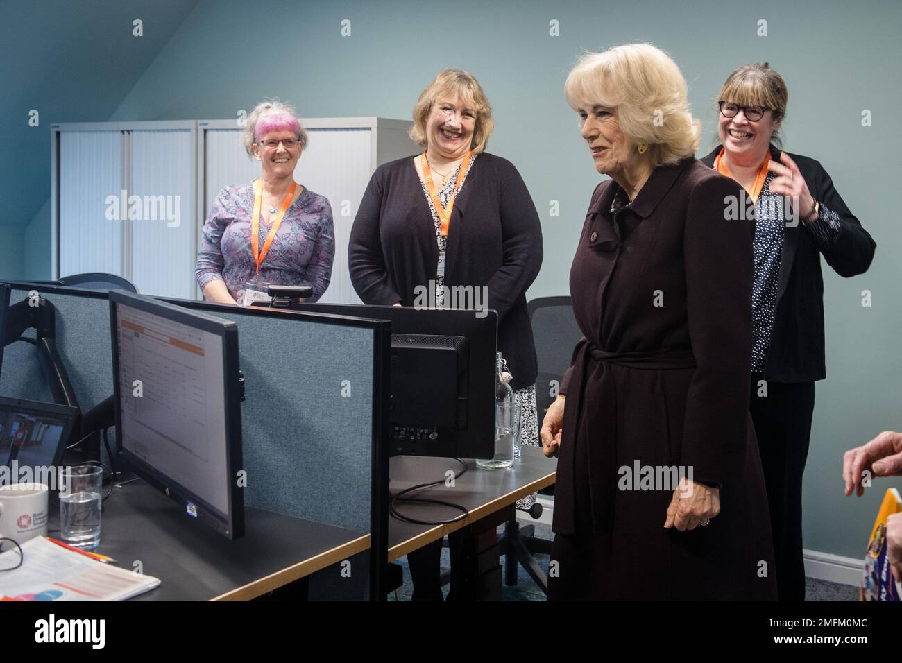The Queen Consort meets members of the helpline team during a visit to ...