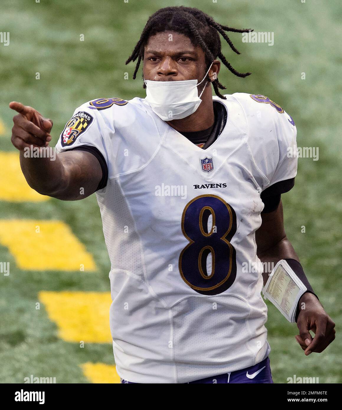 Baltimore Ravens quarterback Lamar Jackson (8) takes to the field