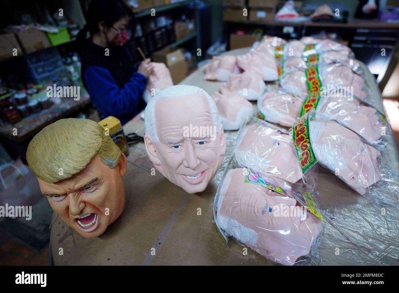 Workers of Ogawa Studios Co. are making rubber face masks of