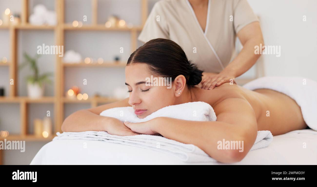 Spa massage, zen and relax customer at beauty salon for body wellness support, chakra energy healing and luxury healthcare. Masseuse woman, calm Stock Photo