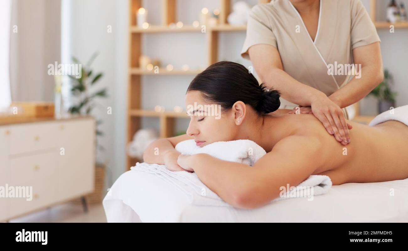 Massage, luxury spa therapy and woman at wellness center for stress, pain relief and to relax body. Calm, peace person and organic zen physiotherapy Stock Photo