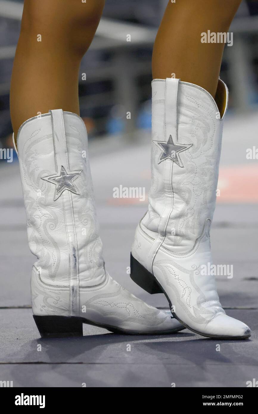 A member of the Dallas Cowboys Cheerleaders performs as the Cowboys