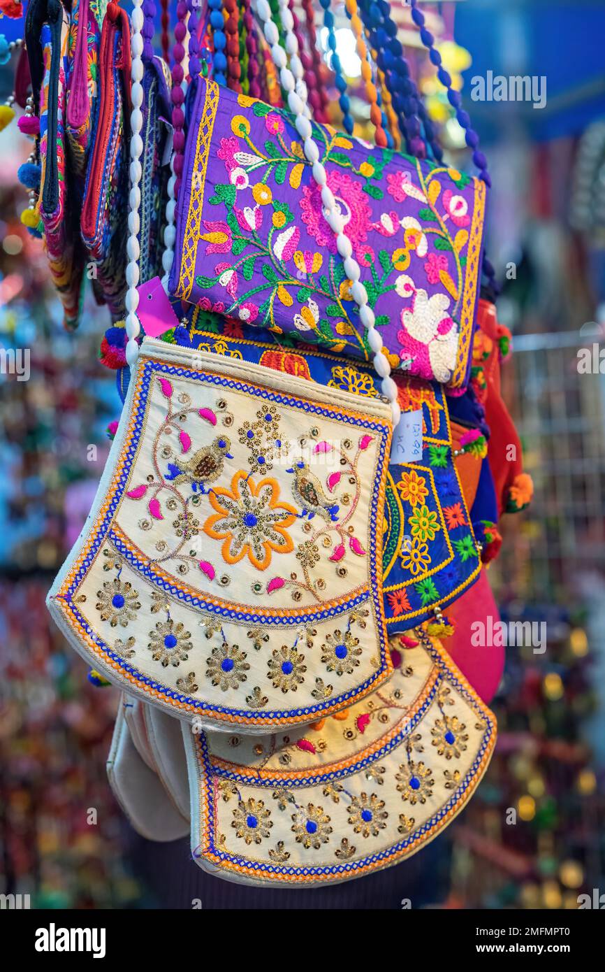 Colourful Indian bags hanging for sale at the market. Stock Photo