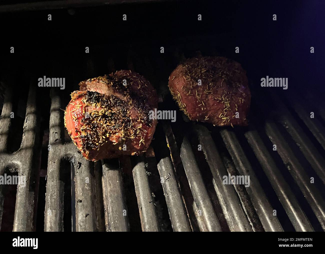 Grilled meat steak on a gas grill Stock Photo Alamy