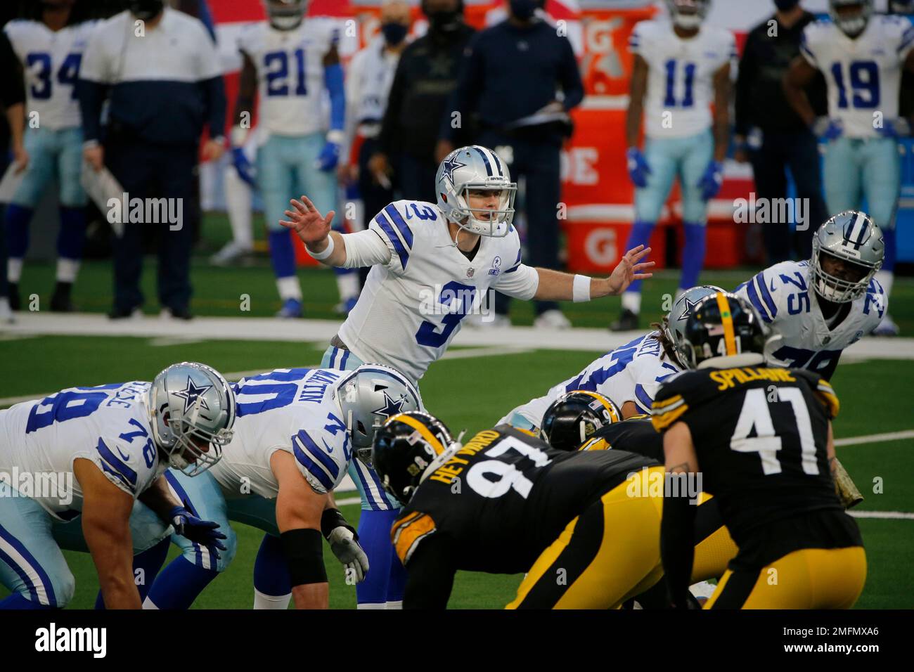Dallas Cowboys quarterback Garrett Gilbert (3) signals at the line of