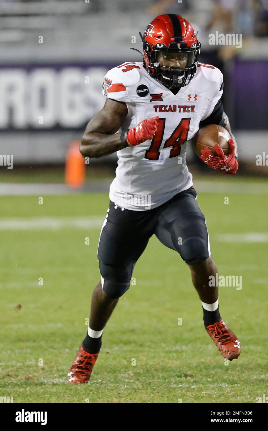 Texas Tech running back Xavier White (14) )carries the ball against TCU ...