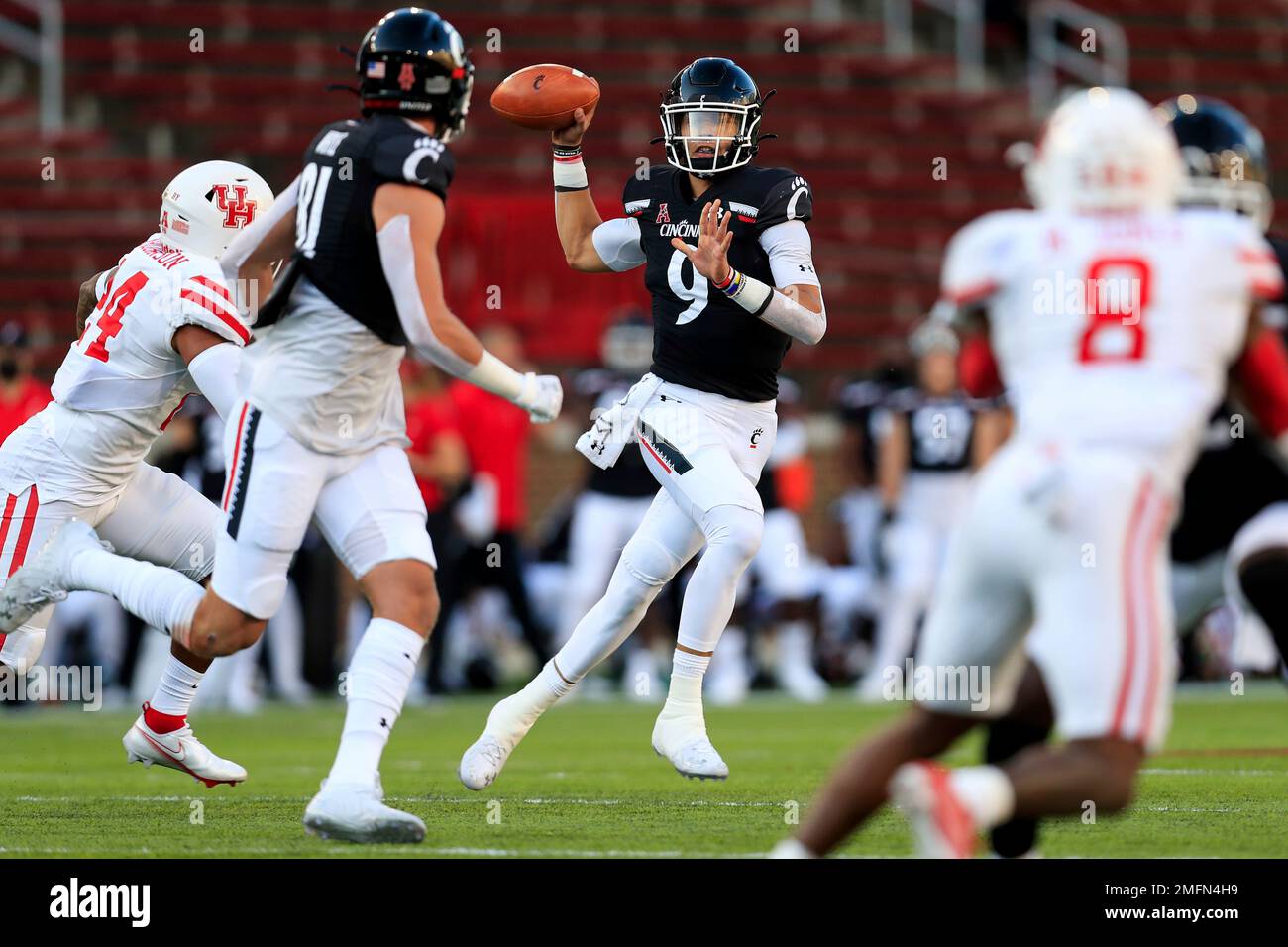 Cincinnati quarterback Desmond Ridder looks to pass during an NCAA ...