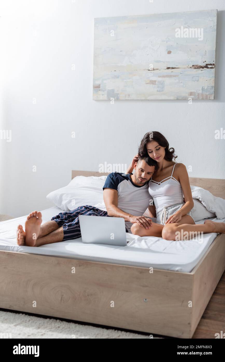Brunette woman hug laptop computer hi-res stock photography and images ...