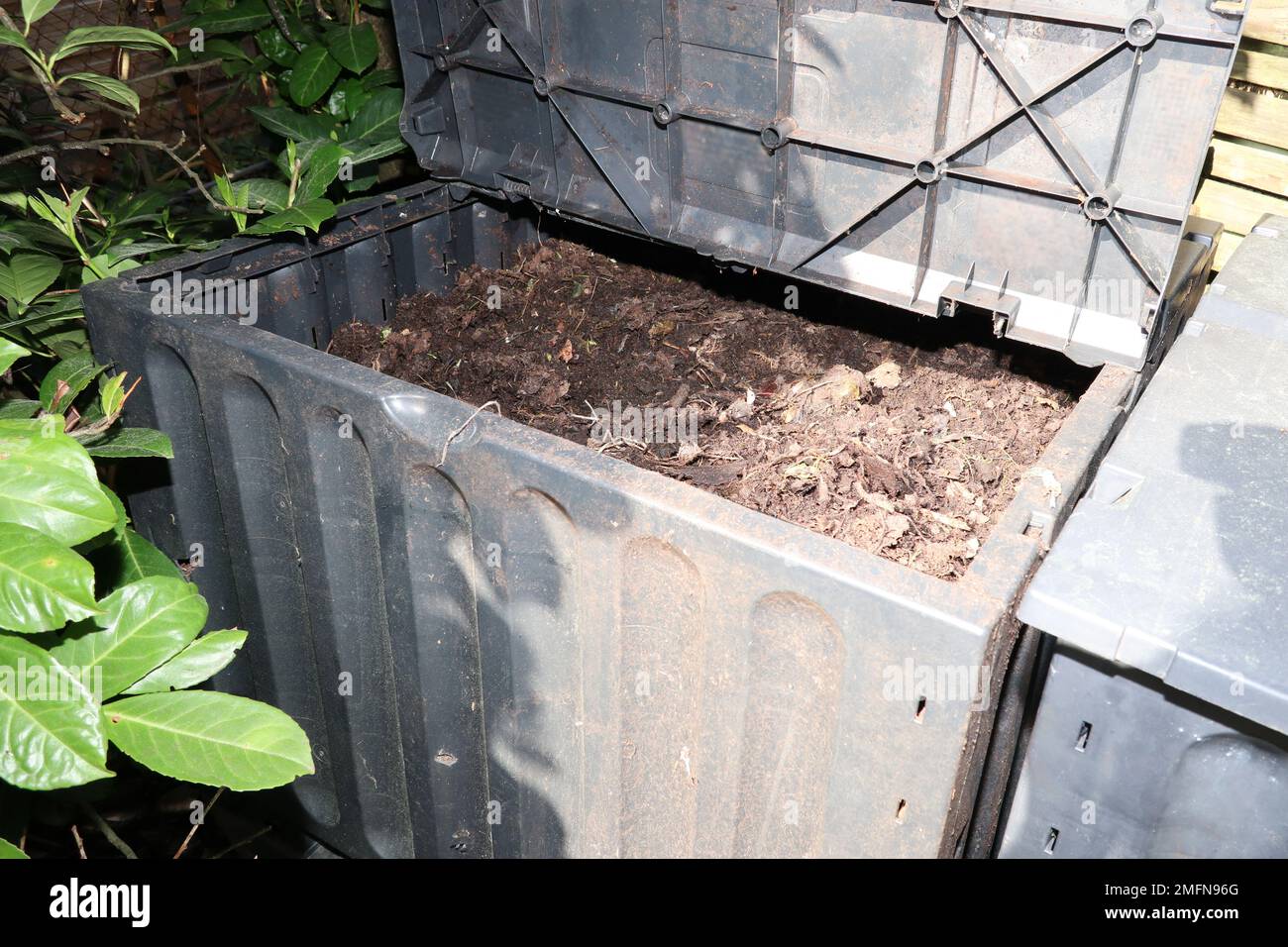 Compost bin in the garden for Composting pile of rotting kitchen fruits
