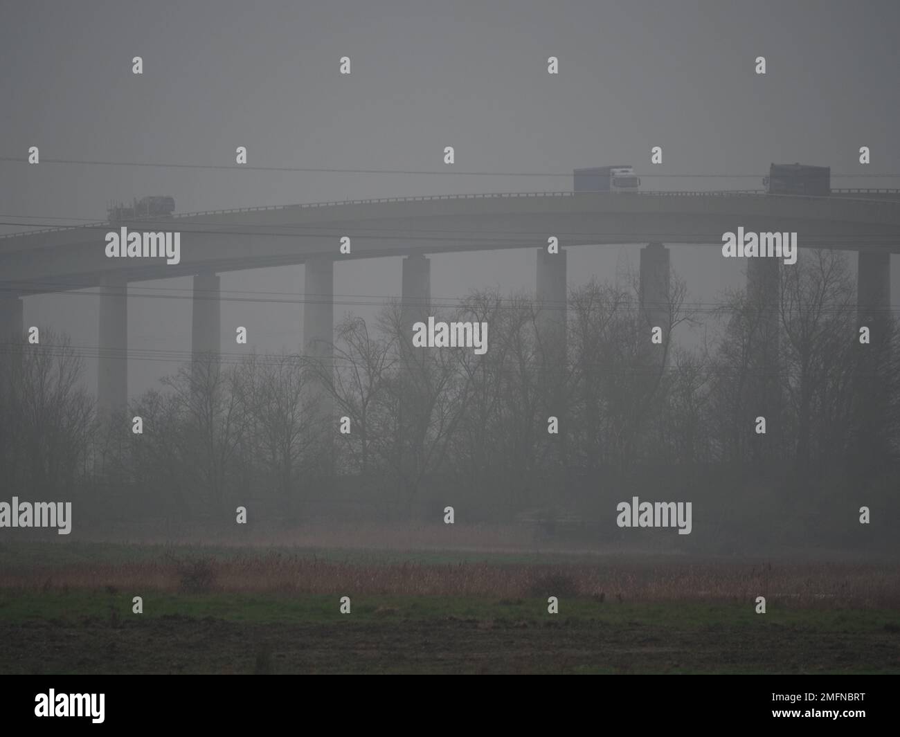 Elmley, Kent, UK. 25th Jan, 2023. UK Weather: a foggy day at the Sheppey Crossing in Kent. Credit: James Bell/Alamy Live News Stock Photo