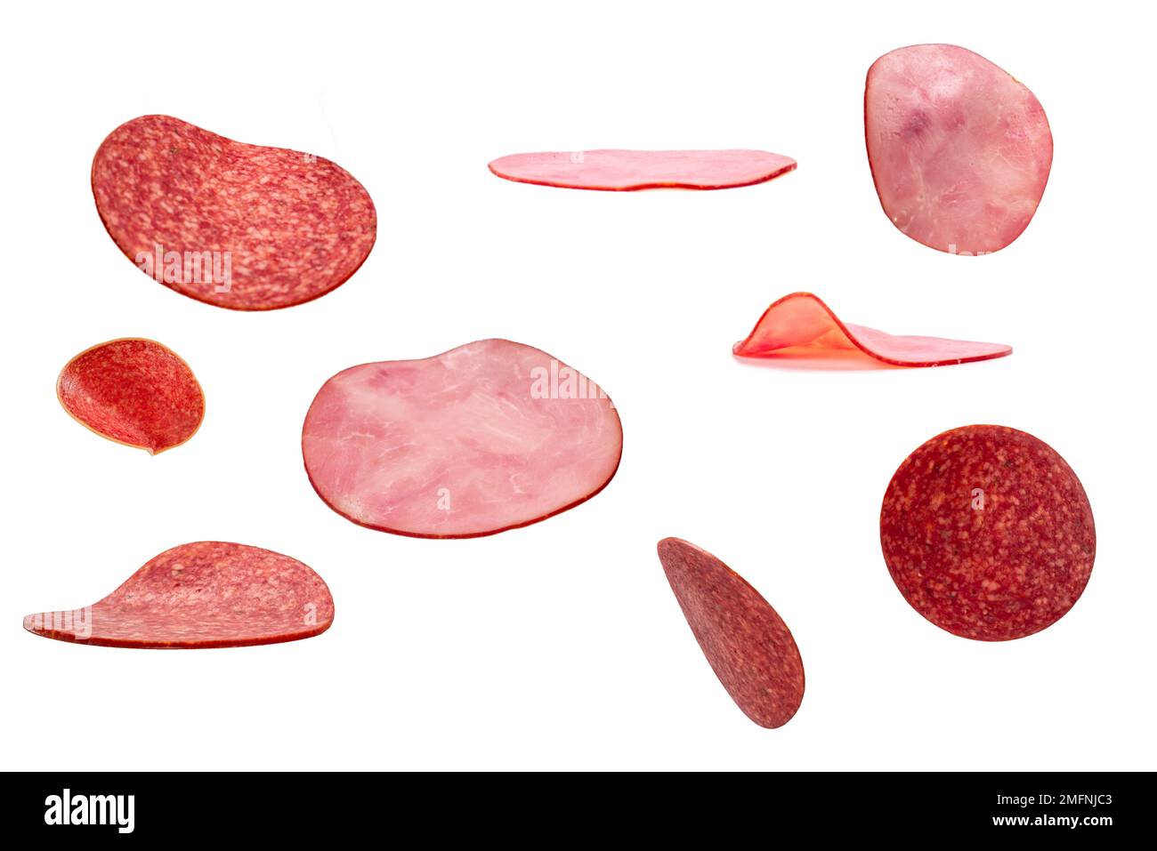 Falling tasty salami isolated on white background. Stock Photo