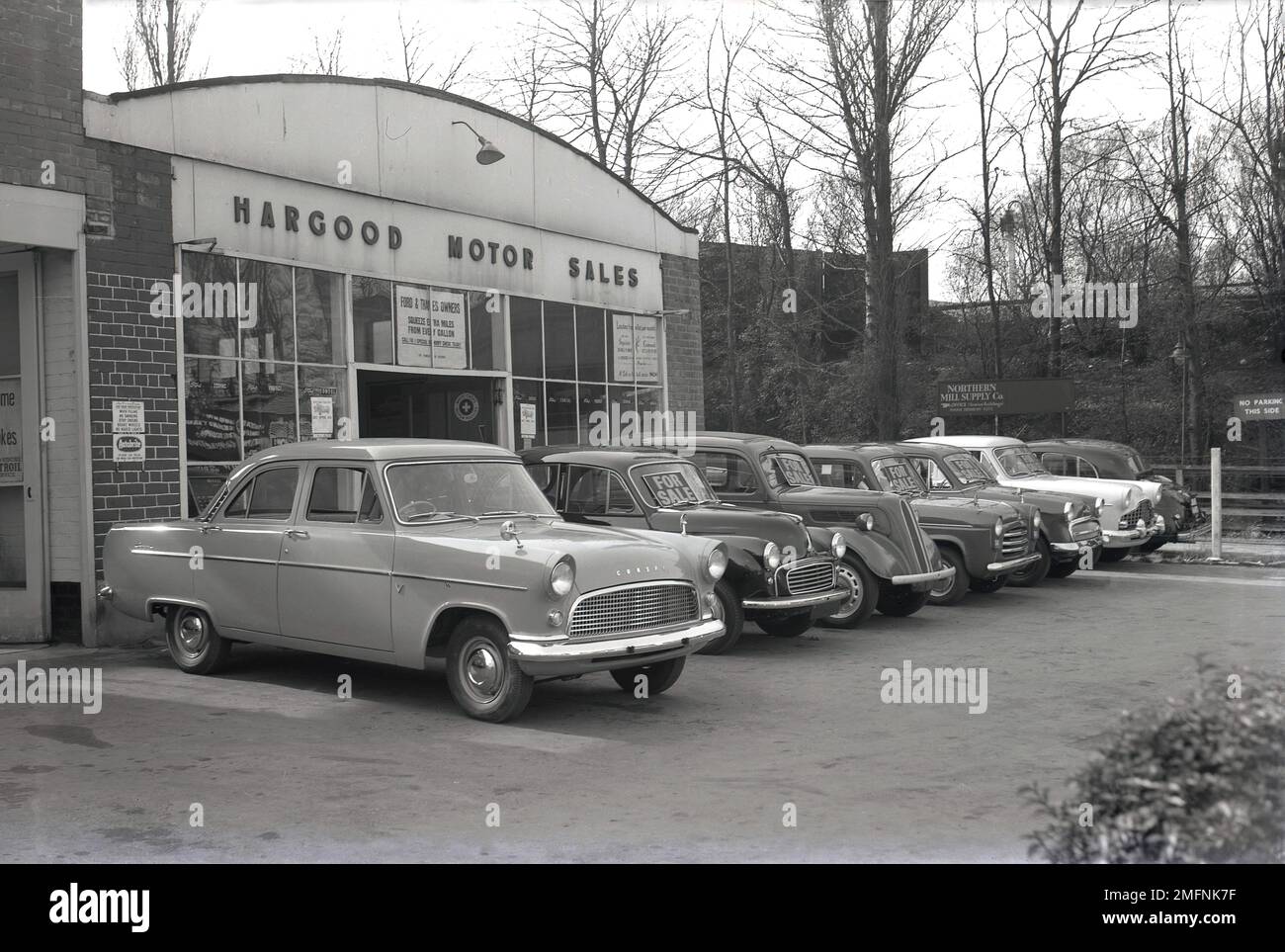 Late 1950s, historical, exterior, cars of the era 'For Sale' on display