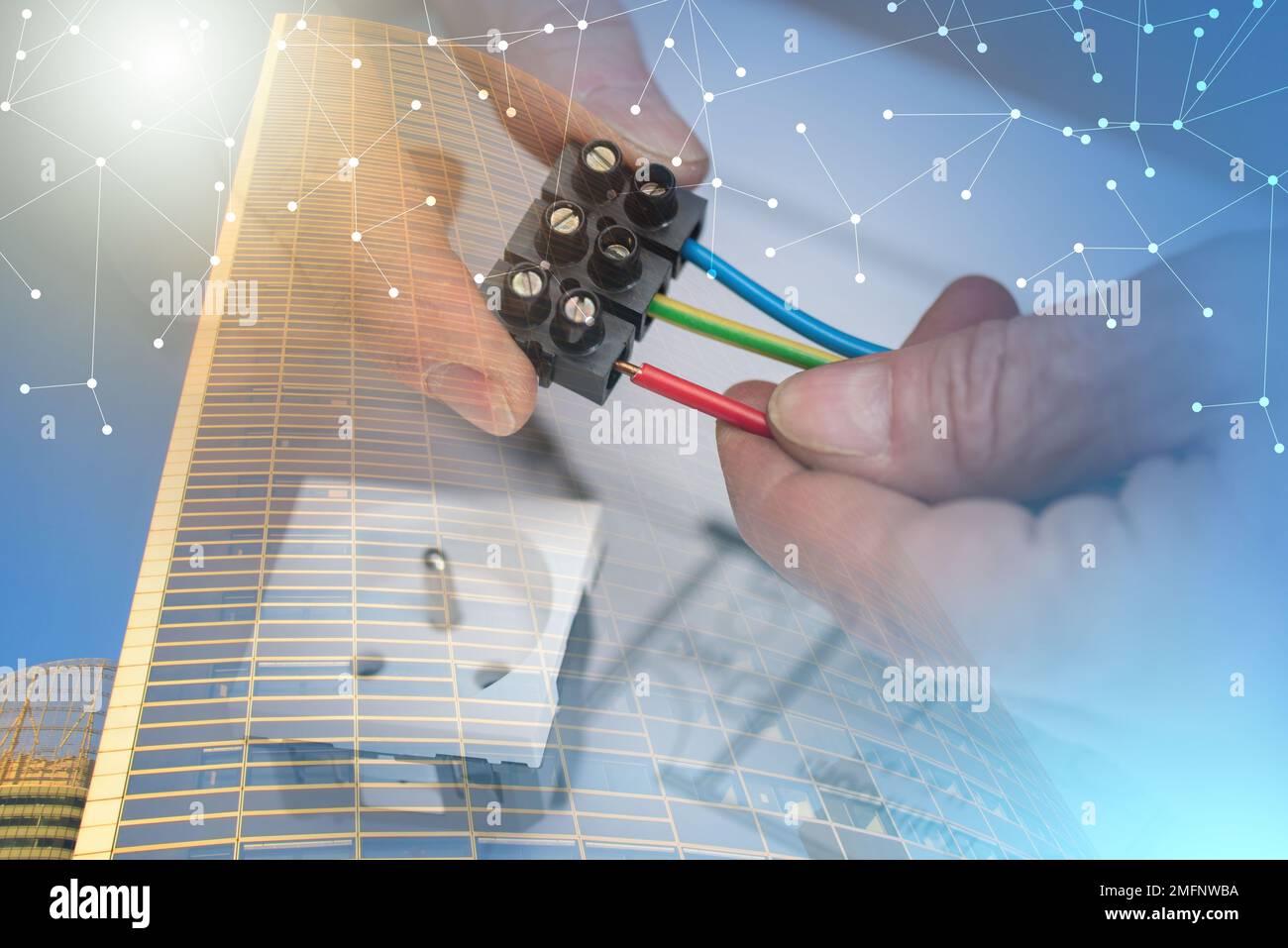 Electrician hands connecting wires in terminal block; multiple exposure Stock Photo