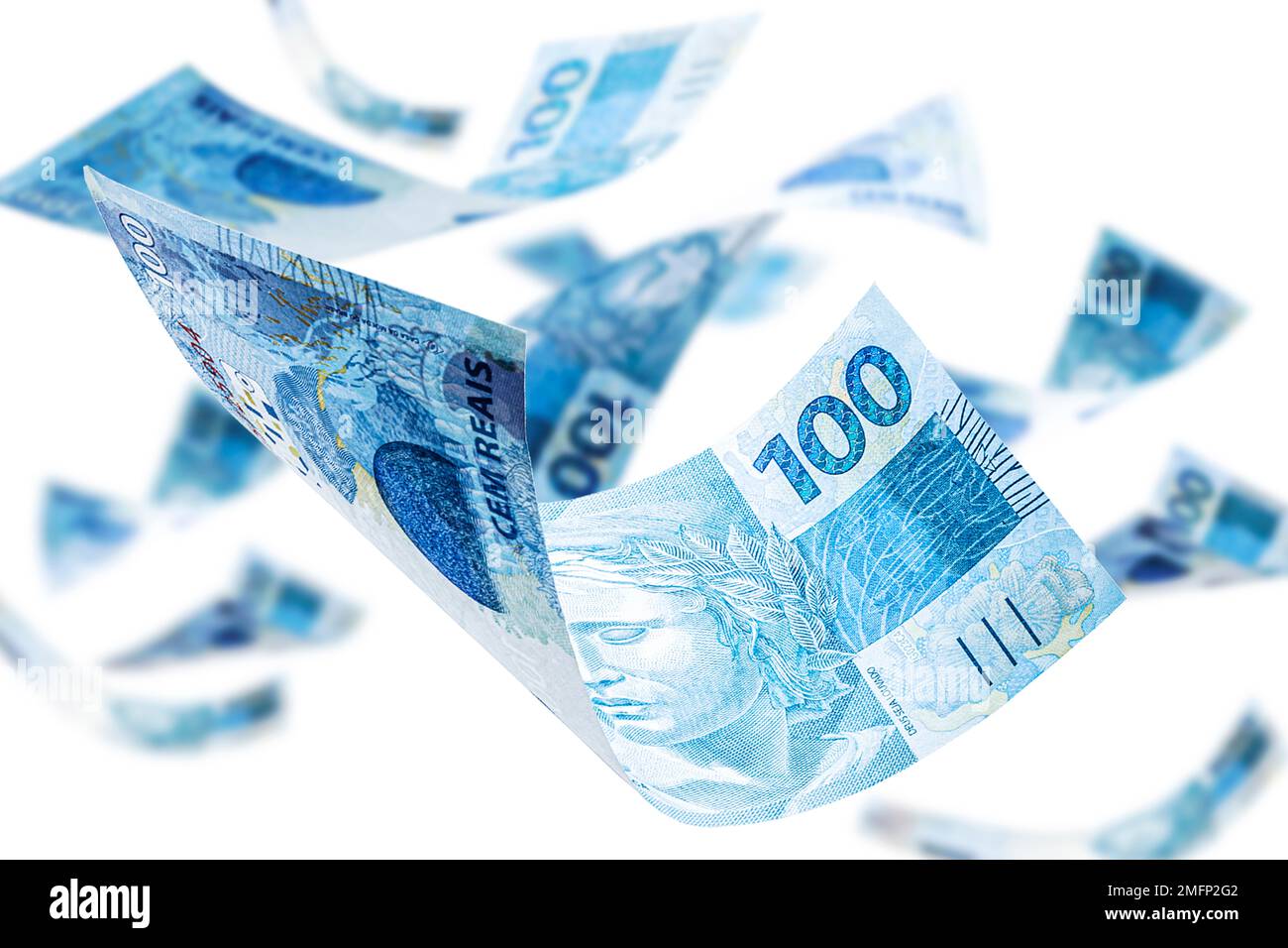 One hundred Brazilian banknotes falling on isolated white background
