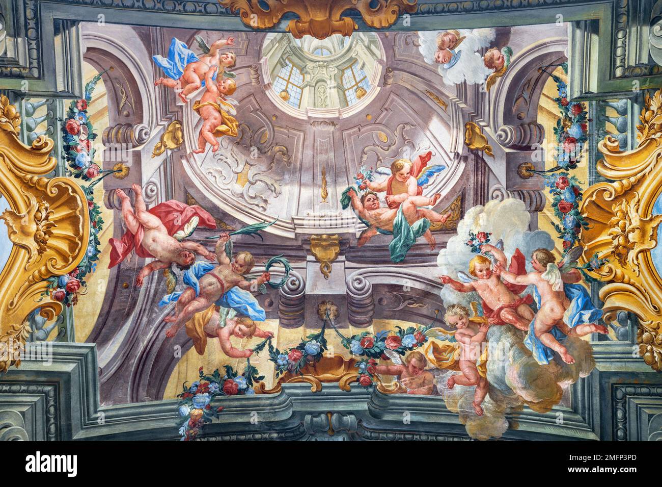 VARALLO, ITALY - JULY 17, 2022: The fresco of baroque angels among the flowers in the church Basilica del Sacro Monte by Francesco Leva (1714). Stock Photo