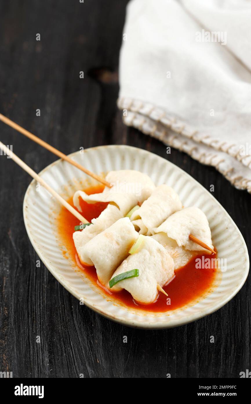Skewered Spicy Eomukguk or Odeng Soup, Korean Popular Street Food Made from Fish Cake Eomuk and Gochujang Paste. Stock Photo
