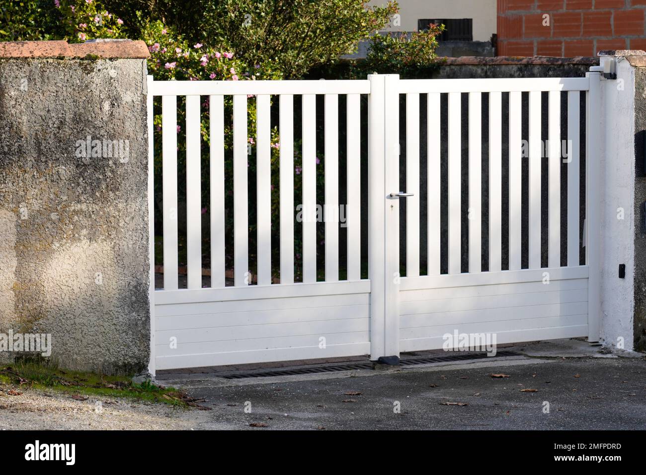 metal steel gate white home fence on suburb street house Stock Photo