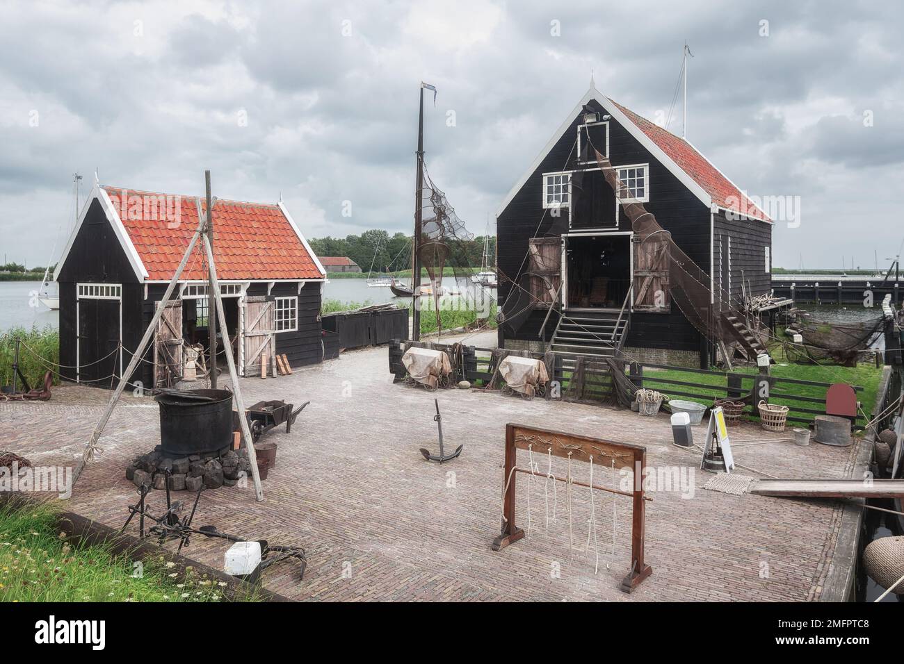 Traditional fishing village with small houses, a church and ships in Enkhuizen, North Holland in the Netherlands. Stock Photo