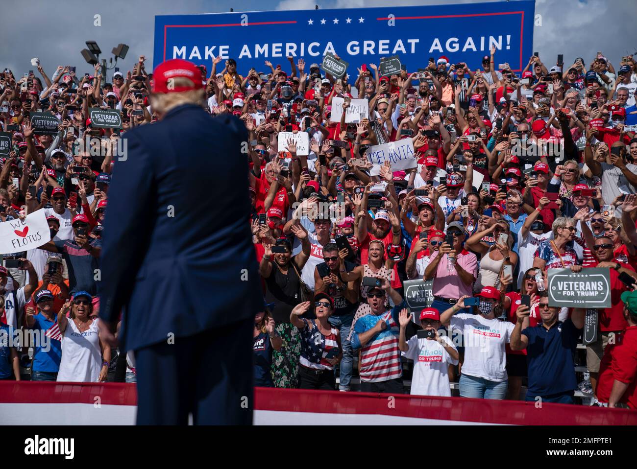 Supporters cheer as President Donald Trump arrives for a campaign rally ...