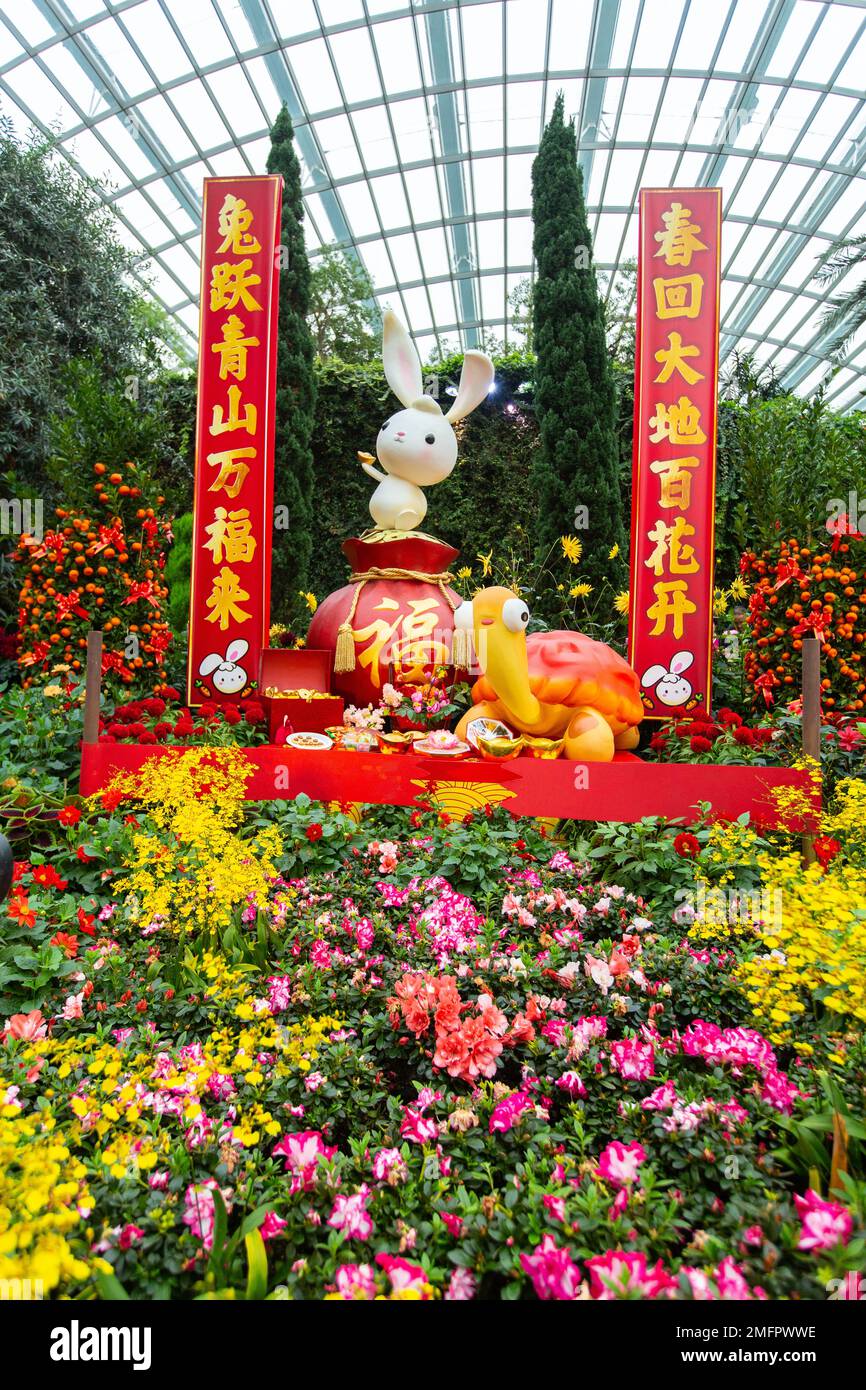Vertical view of Chinese New Year Decoration of Rabbit. Tortoise, beautiful flowers, red banners of auspicious writing. Gardens by the Bay, Singapore. Stock Photo