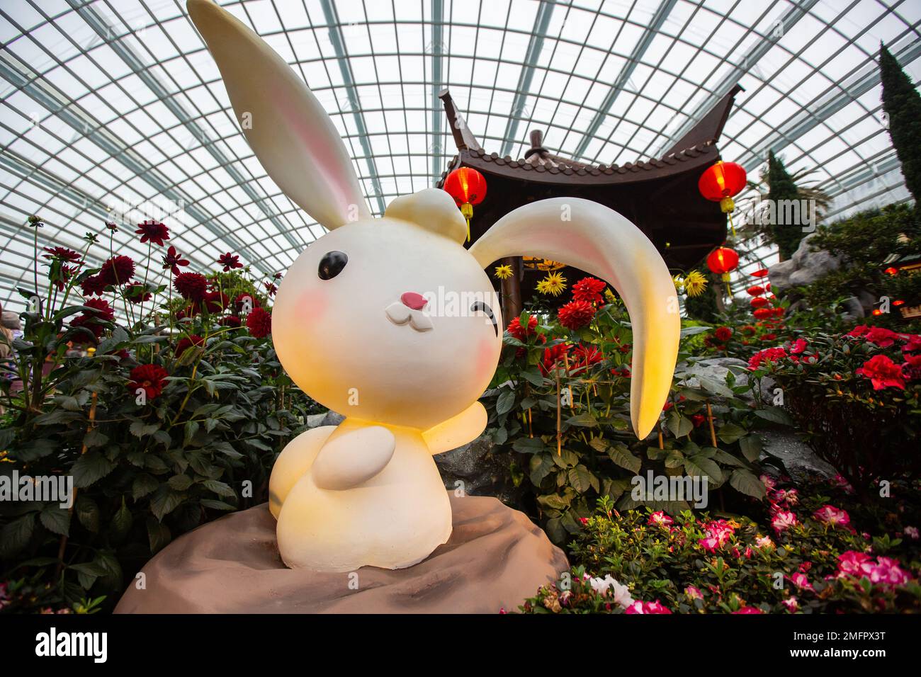 Super cute bunny winking statue decoration inside Flower Dome attraction point, Gardens by the Bay, Singapore. Stock Photo