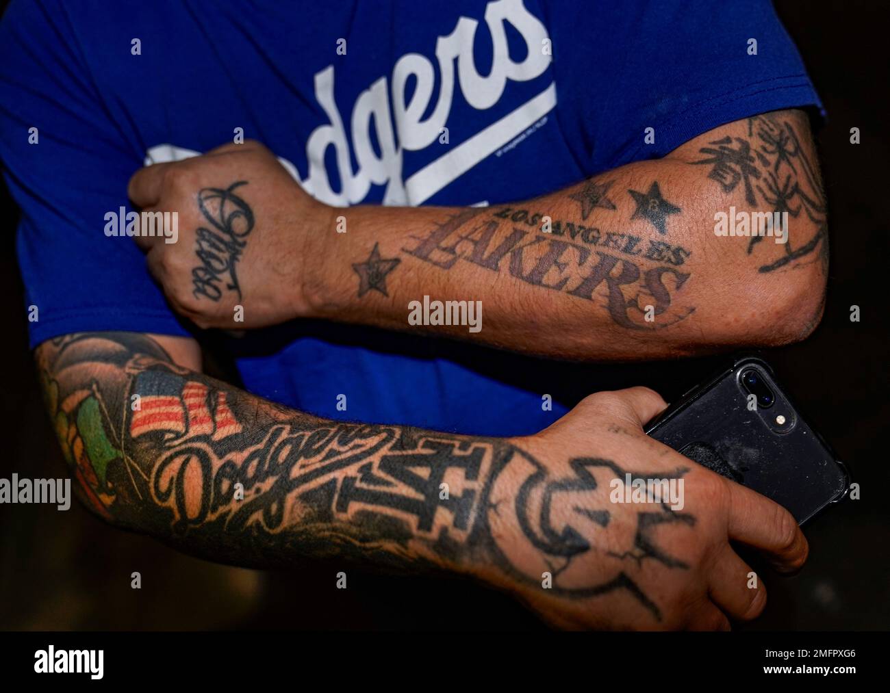 Los Angeles Dodgers fan Vicente Mejia shows his Los Angeles Lakers and  Dodgers tattoos while waiting to see players leave Dodger Stadium in Los  Angeles on Wednesday, Oct. 28, 2020, after the
