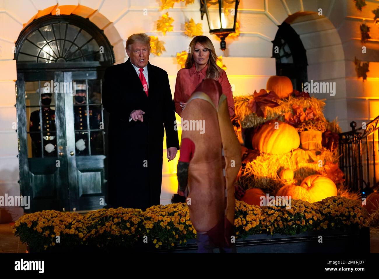 President Donald Trump and first lady Melania Trump greet trickor