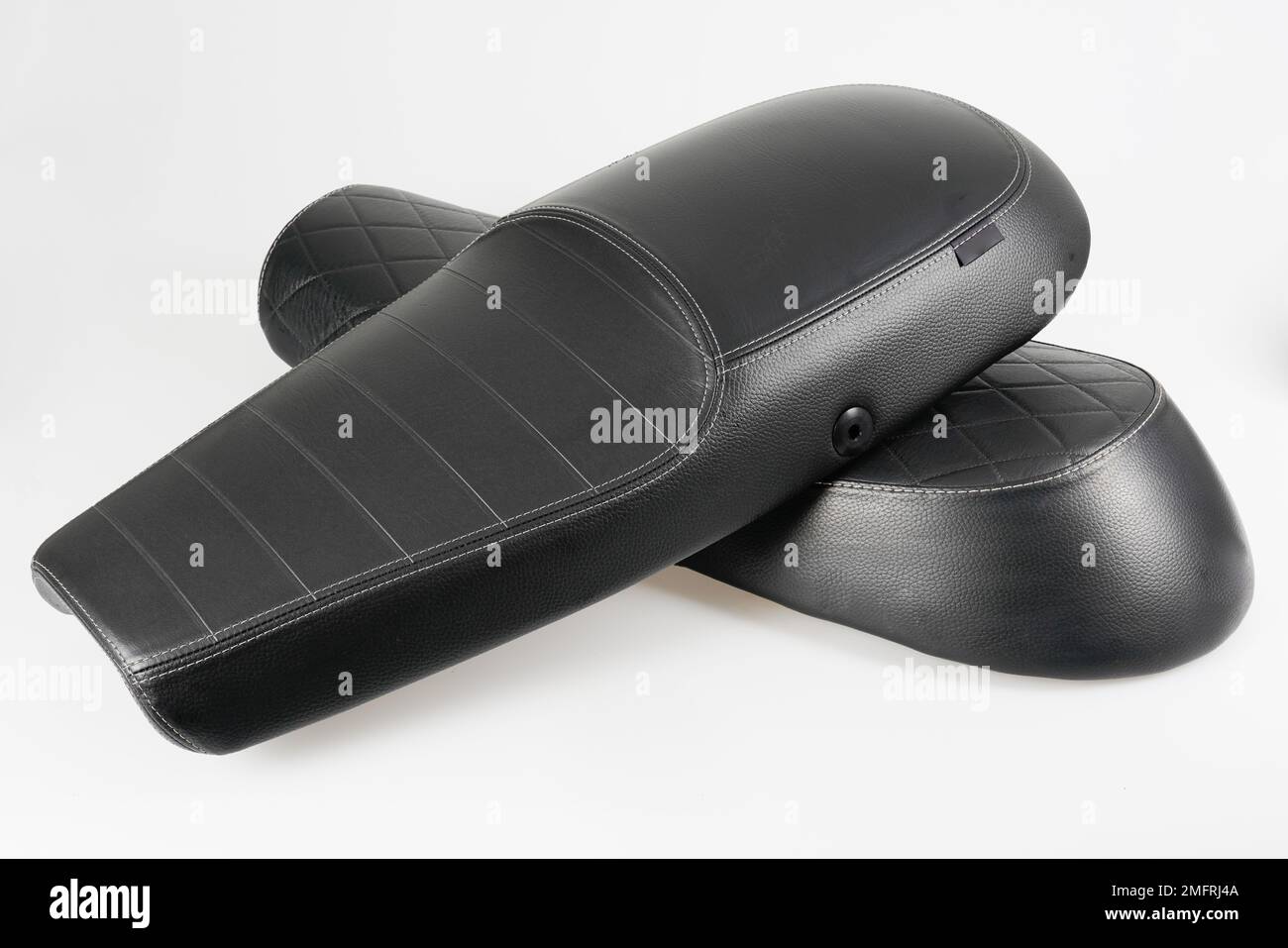 black leather texture motorcycle seat with two models vintage motorbike