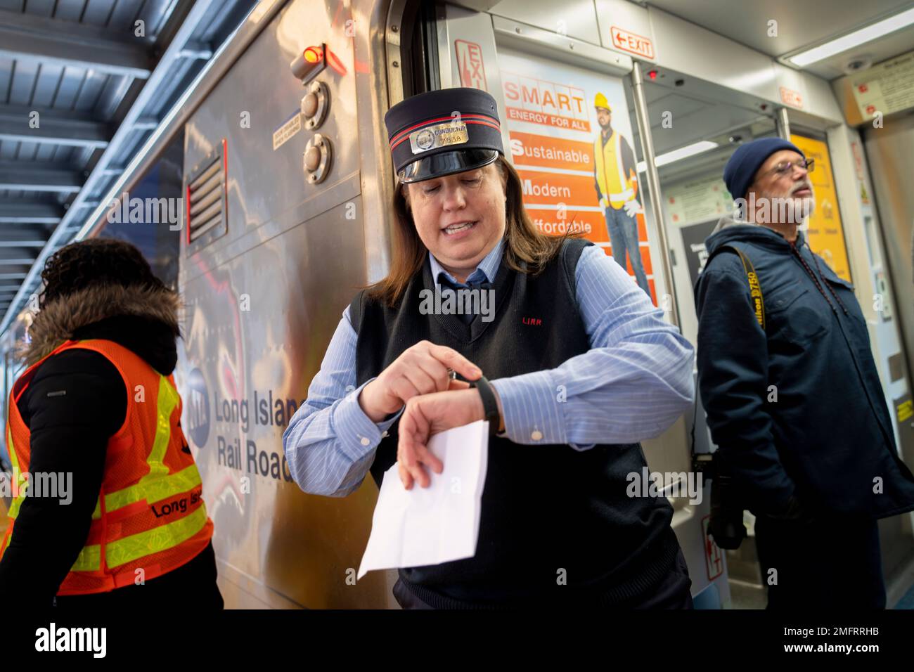 Kelly Curry, a 23-year veteran of the MTA, checks her watch as her Long ...