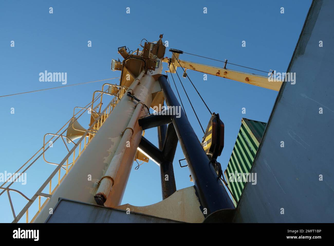 View on forward vessel cream colour mast with ladder and ship's foghorn