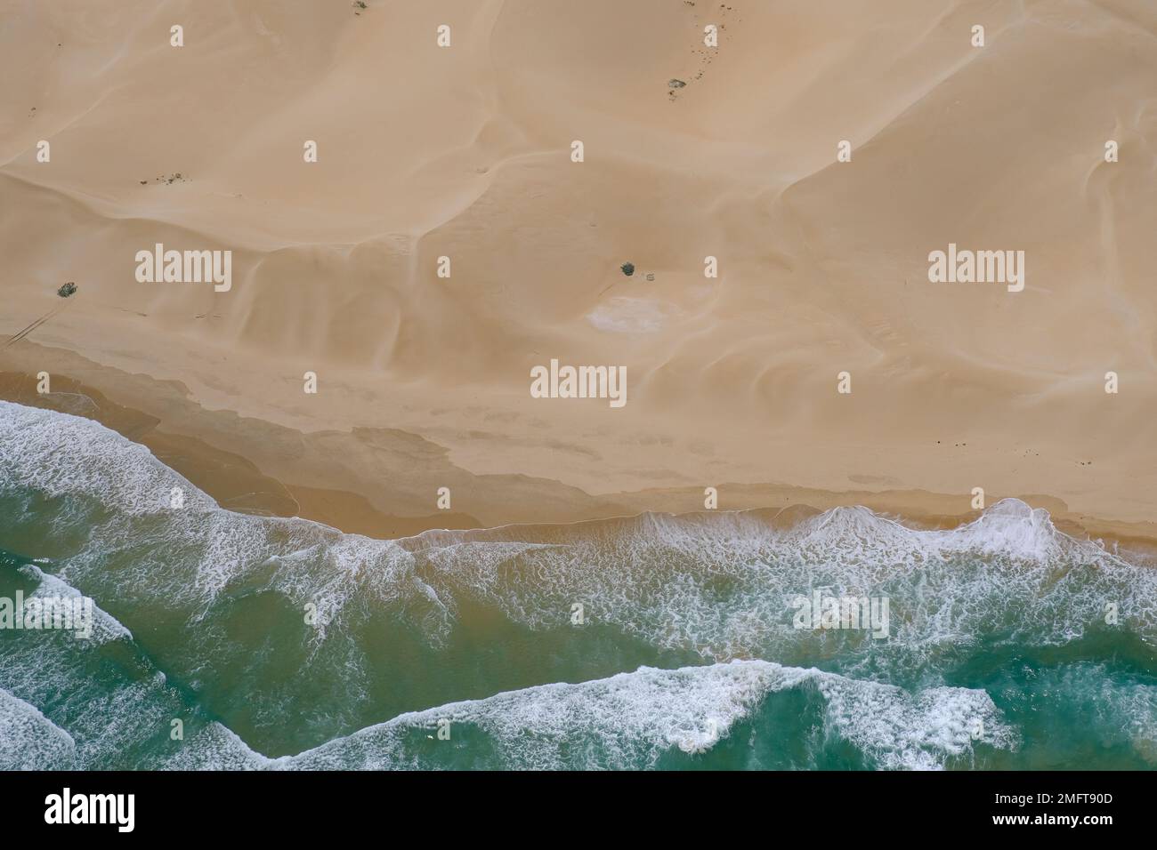 Aerial high angle shot of a lonely stretch of beach near Woody Cape. Stock Photo