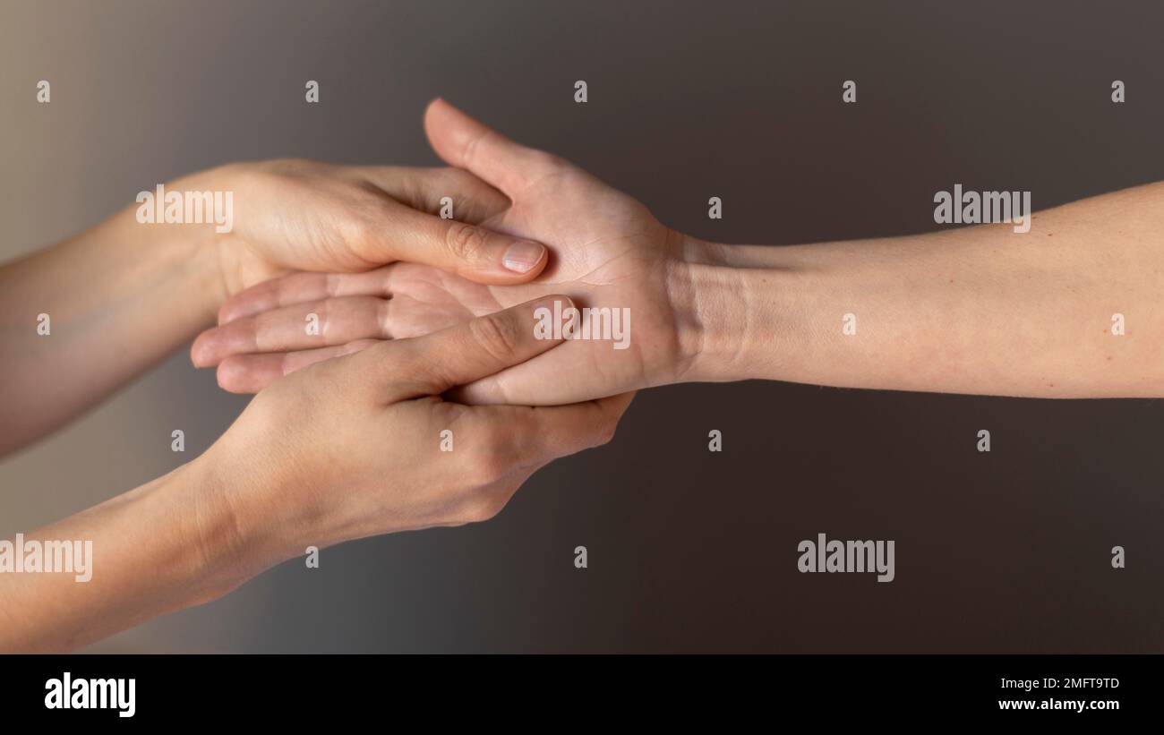 close up hands massaging palm. High resolution photo Stock Photo