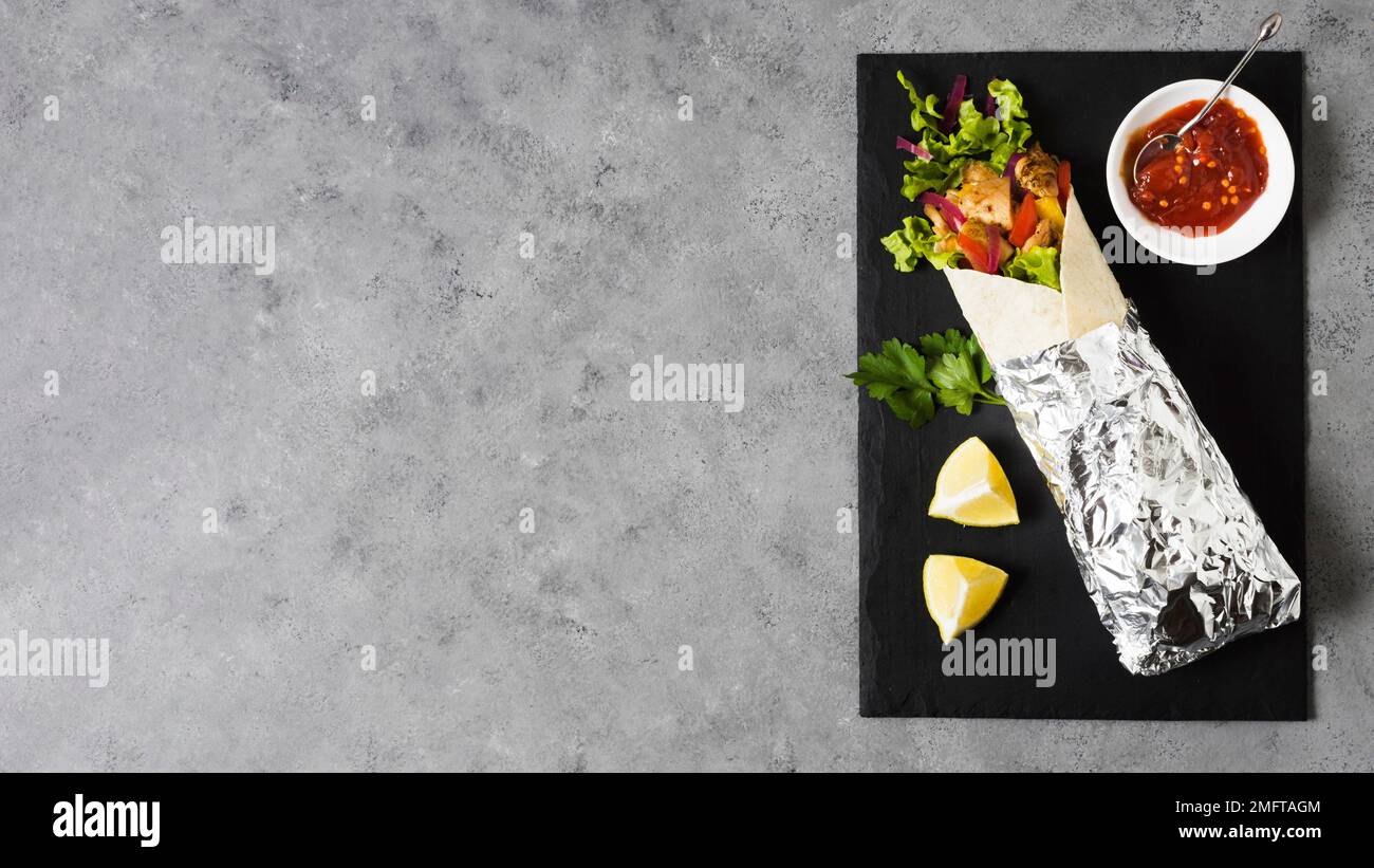 arabic kebab sandwich wrapped aluminium foil copy space. High