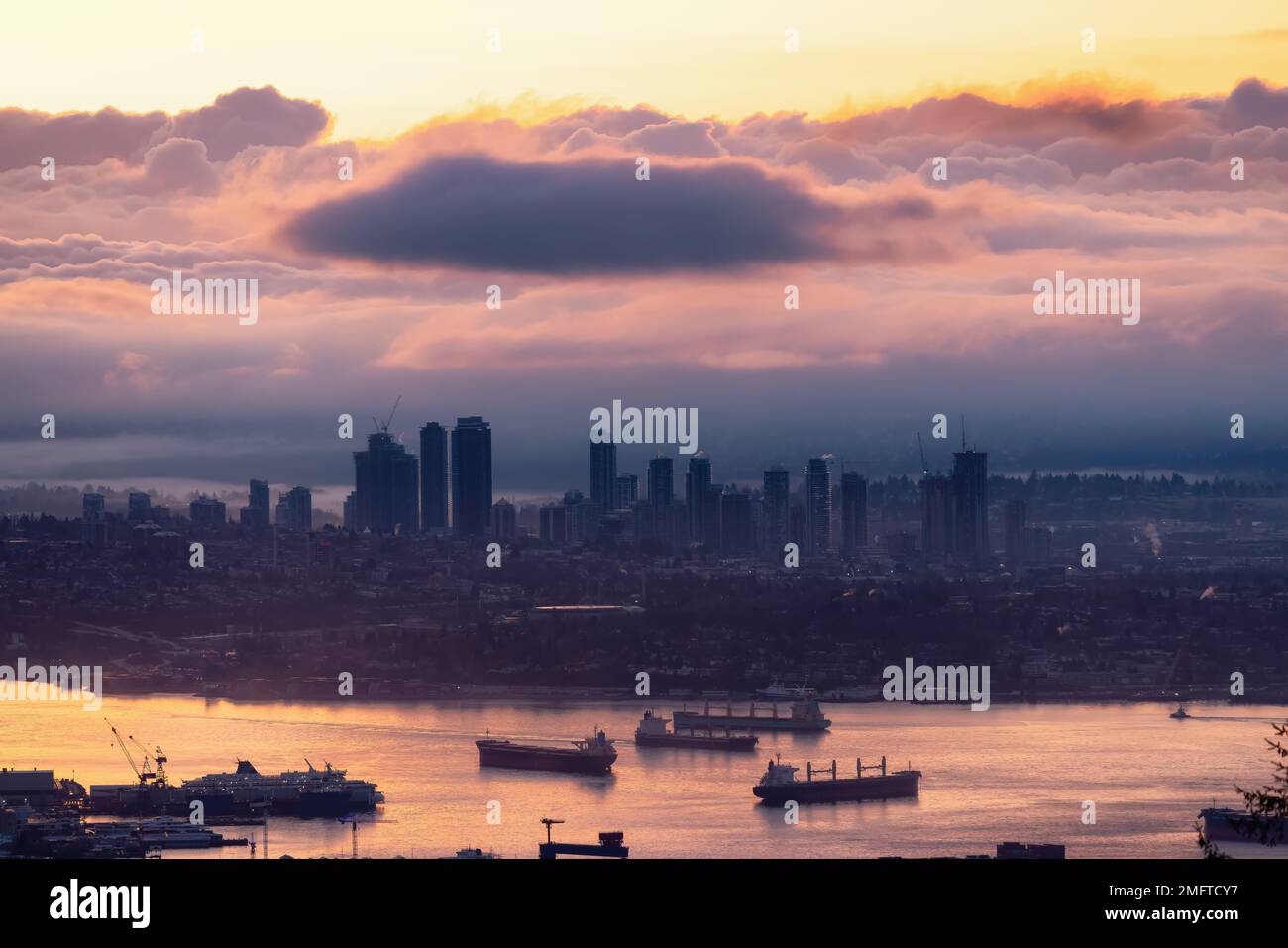 Developed city with industrial and residential buildings. Clouds in Background. Stock Photo